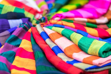 Stack of colourful silk scarfsの写真素材