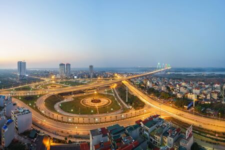 Aerial skyline view of Hanoi city, Vietnam. Hanoi cityscape by sunset period at roundabout to Nhat...