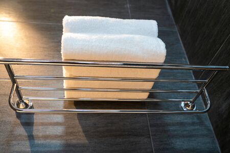 Clean folded bath towels in hotel bathroomの写真素材