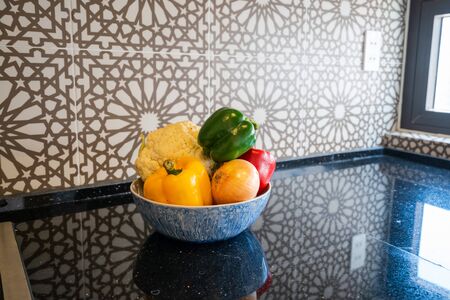 Basket of fruits on kitchen marble. Classical retro wallの写真素材