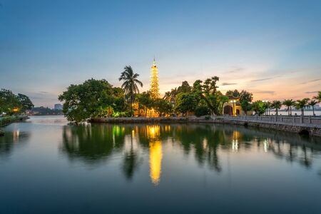 Tran Quoc pagoda, the oldest Buddhist temple in Hanoi, at twilight. The famous destination travel in Hanoiの写真素材
