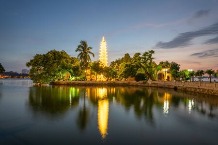 Tran Quoc pagoda, the oldest Buddhist temple in Hanoi, at twilight. The famous destination travel in Hanoiの写真素材