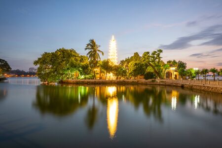 Tran Quoc pagoda, the oldest Buddhist temple in Hanoi, at twilight. The famous destination travel in Hanoiの写真素材
