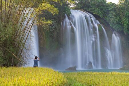 Ban Gioc waterfall with rice field in harvest time in Cao Bang, Vietnamの写真素材