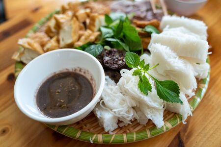 Vietnamese traditional plate pork vermicelli tofu (Bun Dau Mam Tom), the popular lunch set in Hanoi,...