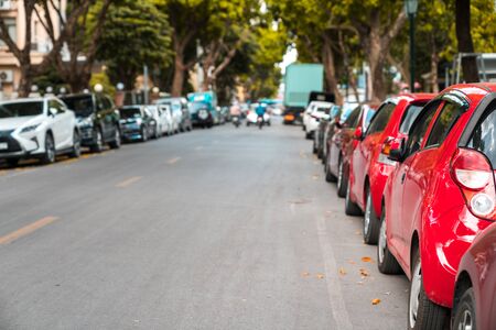 Parallel parking cars on urban street. Outdoor parking on roadの写真素材