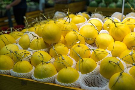 Fresh healthy fruits on shelves in supermarketの写真素材
