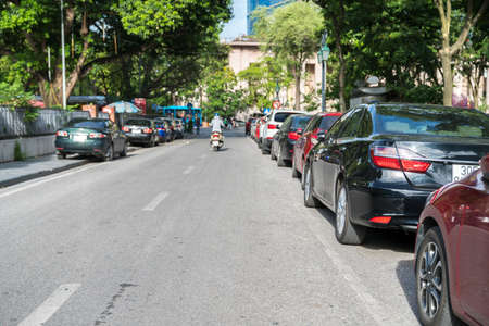 Parallel parking cars on urban street. Outdoor parking on roadのeditorial素材