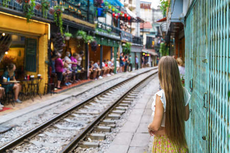 Tourist taking photo of narrow road in old town in Hanoiのeditorial素材