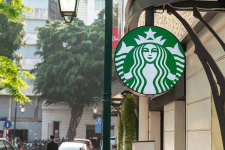 Hanoi, Vietnam - Mar 21, 2019: Starbucks cafe sign at Ly Thai To street, Hoan Kiem, center district...