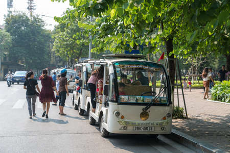 Hanoi, Vietnam - Oct 9, 2018: Sightseeing electric cars in Ôn Dinh Tien Hoang street, Hanoi cityのeditorial素材