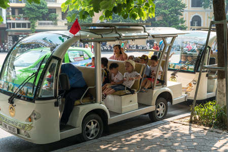 Hanoi, Vietnam - Oct 9, 2018: Sightseeing electric cars in Dinh Tien Hoang street, Hanoi cityのeditorial素材