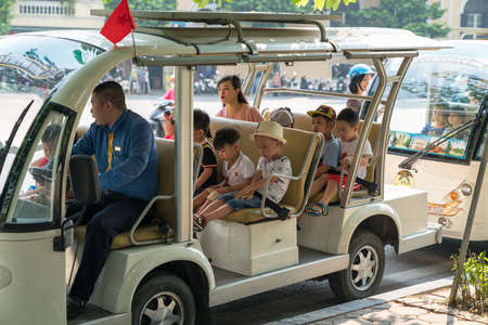 Hanoi, Vietnam - Oct 9, 2018: Sightseeing electric cars in Dinh Tien Hoang street, Hanoi cityのeditorial素材