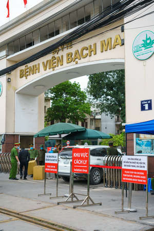 Hanoi, Vietnam - Mar 31, 2020: Isolation or Quarantine sign outside of main entrance of Bach Mai hospital during covid-19 coronavirus pandemicのeditorial素材