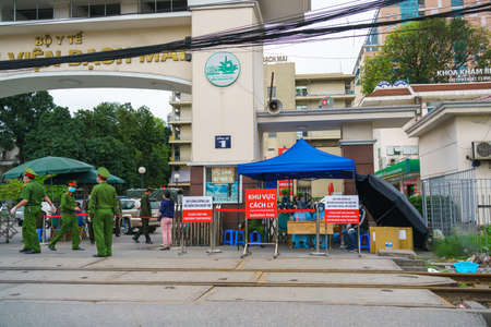 Hanoi, Vietnam - Mar 31, 2020: Main entrance of Bach Mai hospital, locked down as a major Covid-19 outbreak area, during covid-19 coronavirus pandemicのeditorial素材