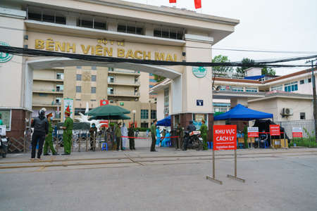 Hanoi, Vietnam - Mar 31, 2020: Isolation or Quarantine sign outside of main entrance of Bach Mai hospital during covid-19 coronavirus pandemicのeditorial素材