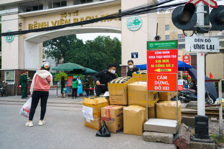 Hanoi, Vietnam - Apr 1, 2020: Isolation or Quarantine sign outside of main entrance of Bach Mai hospital during covid-19 coronavirus pandemicのeditorial素材