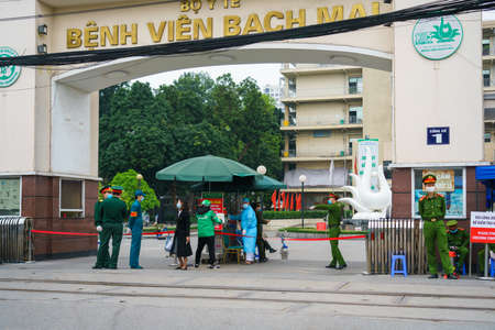 Hanoi, Vietnam - Apr 1, 2020: Main entrance of Bach Mai hospital, locked down as a major Covid-19 outbreak area, during covid-19 coronavirus pandemicのeditorial素材