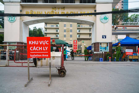 Hanoi, Vietnam - Apr 1, 2020: Isolation or Quarantine sign outside of main entrance of Bach Mai hospital during covid-19 coronavirus pandemicのeditorial素材