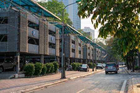 Hanoi street with automated level stacked car parking lot in Hanoiの写真素材