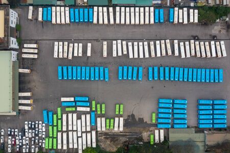 Aerial view of city buses in the parking lot at the bus station