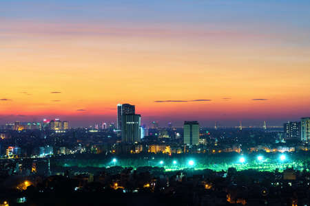 Cityscape of Hanoi skyline at Vinh Tuy bridge over Red river during sunset timeの写真素材