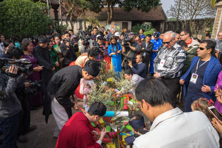 Hanoi, Vietnam - Jun 22, 2017: Raising Neu tree rituals in communal house at So village, Quoc Oai district. The bamboo pole placed in front of house on the last day of the lunar year to expel evilsのeditorial素材