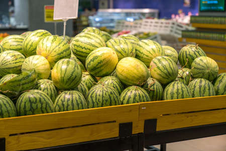 Fresh healthy fruits on shelves in supermarketの写真素材