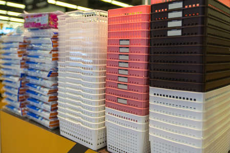 Colored plastic baskets for sale in supermarket