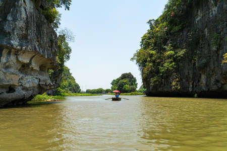 Ngo Dong river with tourism boat in Tam Coc, Ninh Binh, Vietnamの写真素材