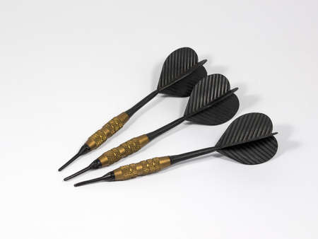 ISOLATE OF THREE BLACK DARTS WITH GOLD GRIPの写真素材