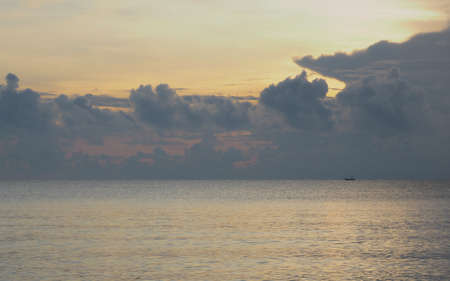 A LONE BOAT ON THE HORIZONの写真素材