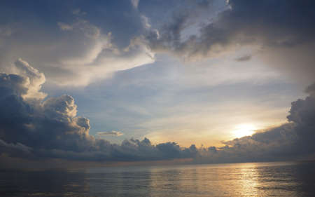 Cloudy sky open above the seaの写真素材