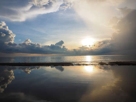 Beautiful reflection of the sky on the seaの写真素材
