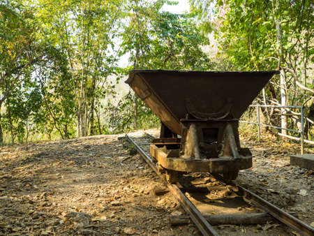 OLD UNUSED CART ON A BROKEN RAILWAYの写真素材
