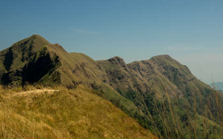 SCENIC VIEW OF A MOUNTAIN WHILE  HIKING UP ANOTHERの写真素材