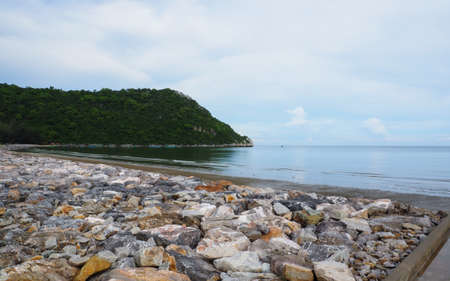 ROCK BARRIER IN A FISHING VILLAGE IN THAILAND