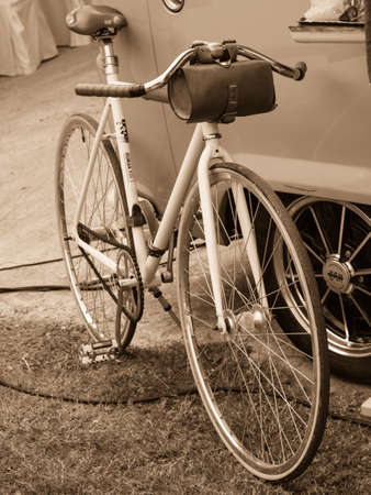 Classic bicycle leaning on a truck