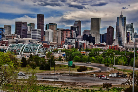 Denver skyscrapers viewed from across highwayのeditorial素材