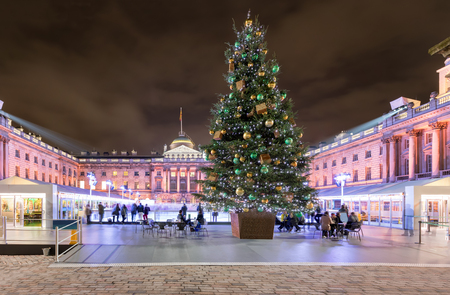 The Somerset House in London with a christmas tree and ice rink in winter timeの写真素材