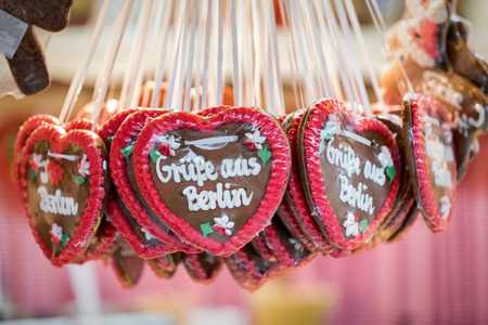 Hanging gingerbread hearts with the writing Greetings from Berlin