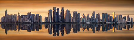 The modern skyline of Doha, Qatar, during a cloudy sunsetのeditorial素材