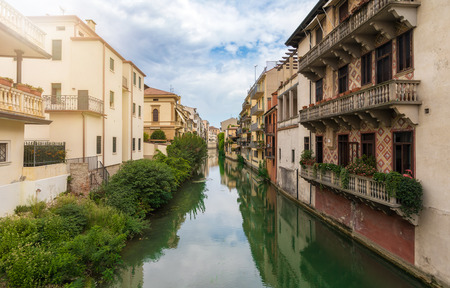 Houses on a river in Padova, Italyの写真素材