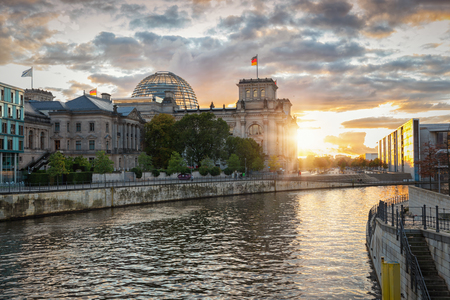 The Reichstag, parliament, in Berlin, Germany, during sunsetの写真素材