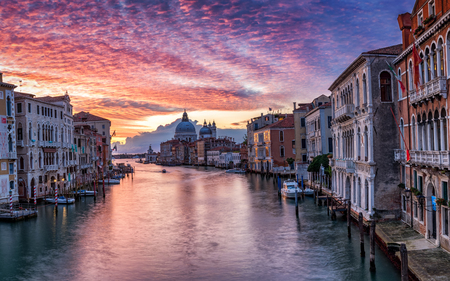 View to the Basilica di Santa Maria della Salute and the Canale Grande in Venice, Italy, during an intensive sunriseの写真素材