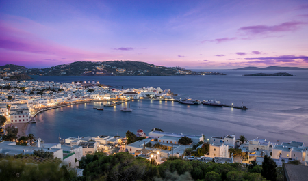 View over the town of Mykonos island in Greece during a colorful and romantic sunsetのeditorial素材