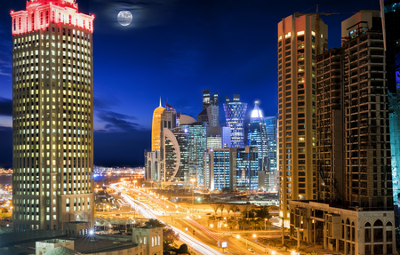 Panorama of downtown City Center Doha, Qatar, during night with moon