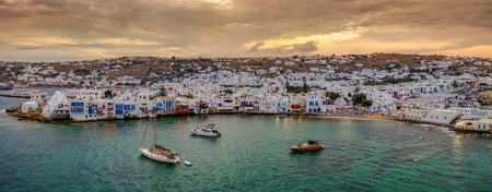 Panoramic view to the bay and town of Mykonos island during sunset time, Cyclades, Greeceの写真素材