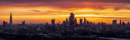 Very wide, panoramic sunset view over the modern cityscape of London, Englandの写真素材