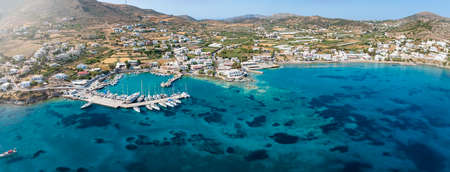 Panoramic aerial view of the beach and marina of Finikas, Syros island, Greece, with turquoise seaの写真素材
